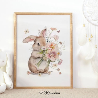 Tableau murale d’un petit lapin tenant un bouquet de fleur 